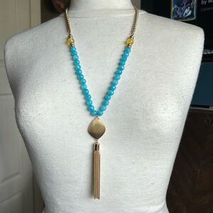 Golden tassel and semiprecious light blue colored jasper beads collar